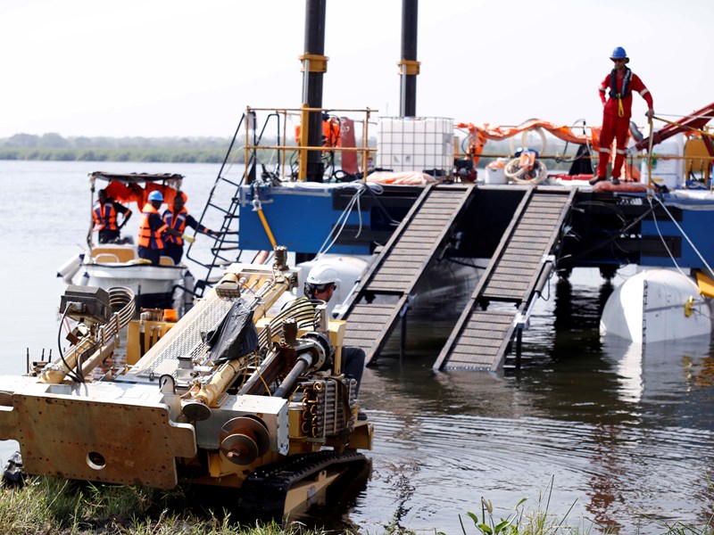 Loading the CPTu rig onto the geomechanics designed and built Jack-up barge, for testing in the riverbed