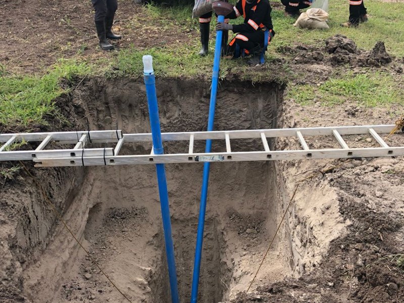 GeoGroup installing a piezometer in a test pit